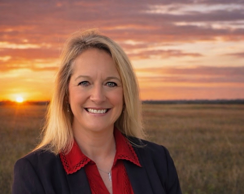 Cheryl Swan in a Coffee County sunset field